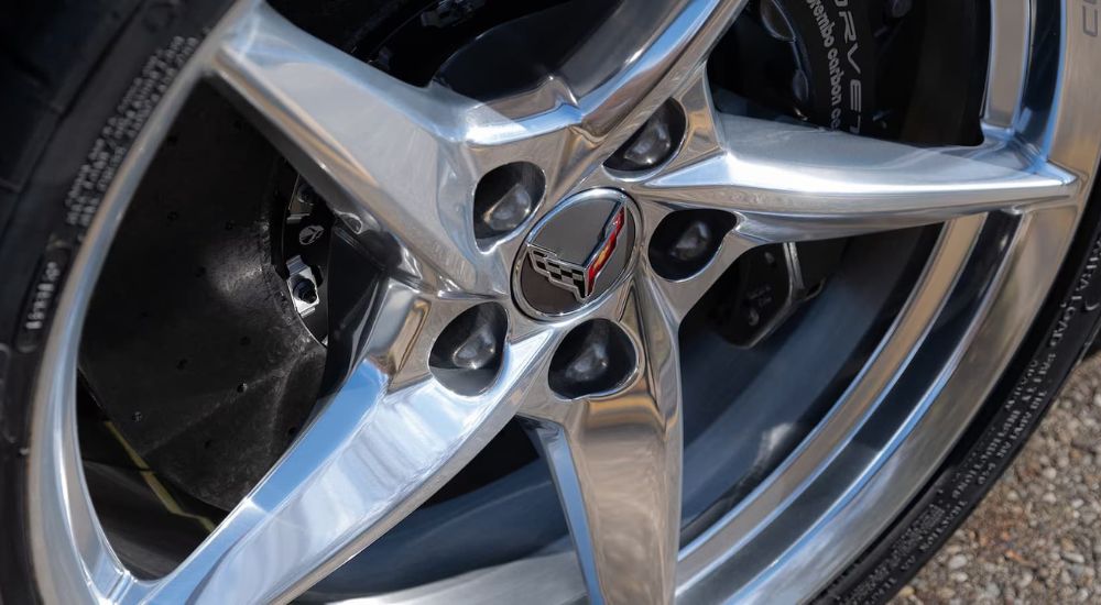 The silver wheel of the 2024 Chevy Corvette E-Ray is shown. 