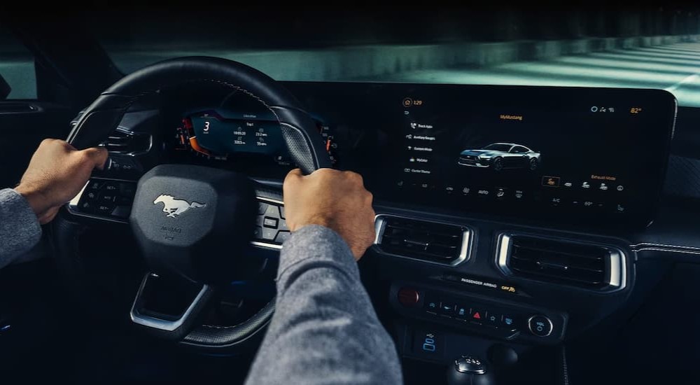 The black interior and dash of a 2024 Ford Mustang Dark Horse is shown.