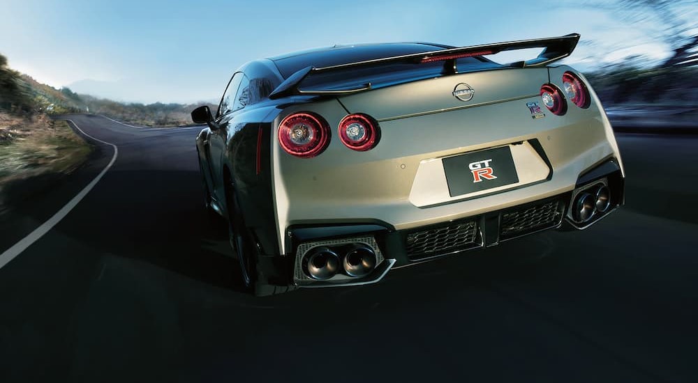 A 2024 Nissan GT-R is shown from the rear.