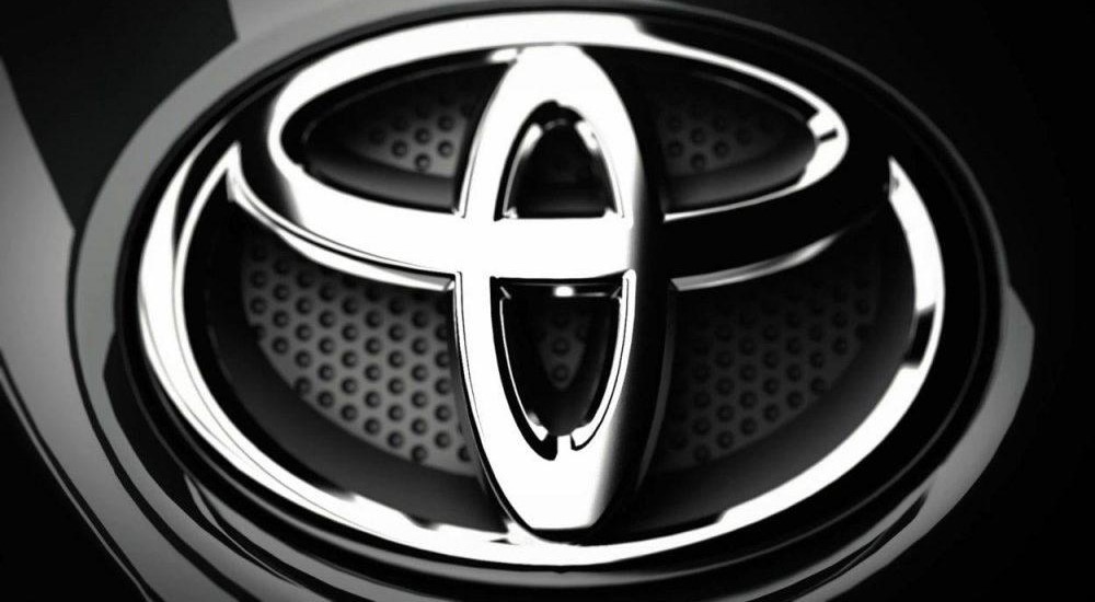 A Toyota emblem is shown at a used Toyota dealer.