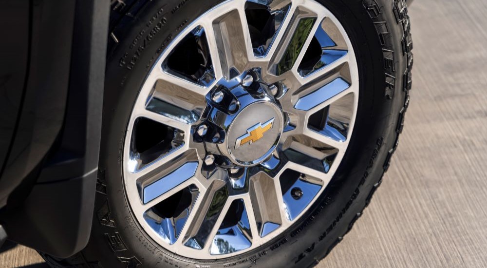 The tire and rim of a 2024 Chevy Silverado 2500 HD is shown.