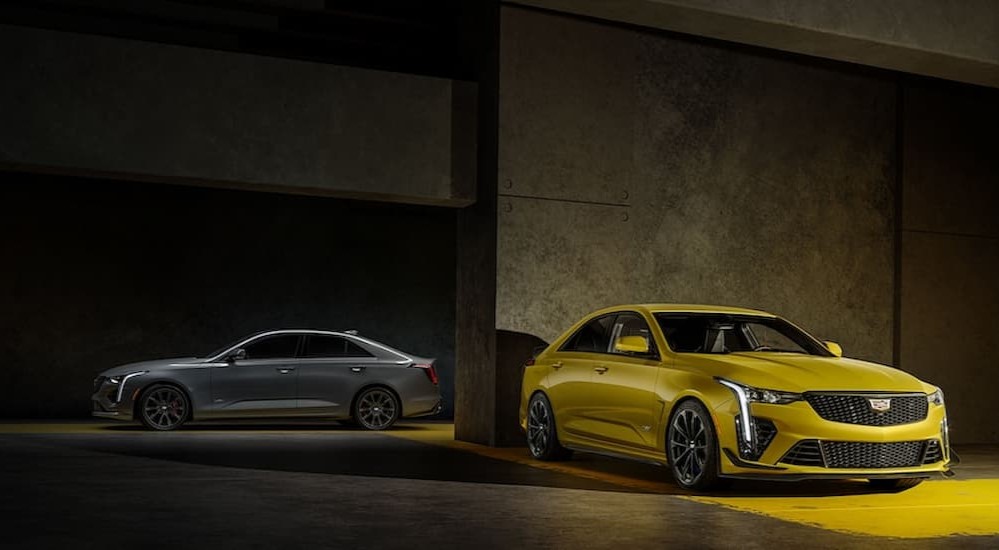 A silver and yellow 2023 Cadillac CT4-V Blackwing are shown parked in a parking garage.