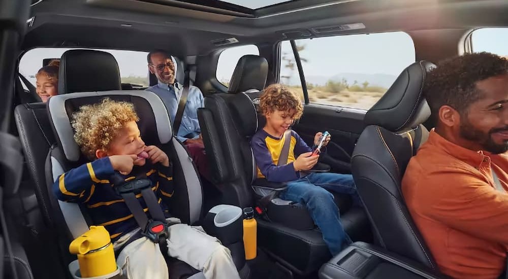 A family is shown inside of a 2024 Toyota Grand Highlander.