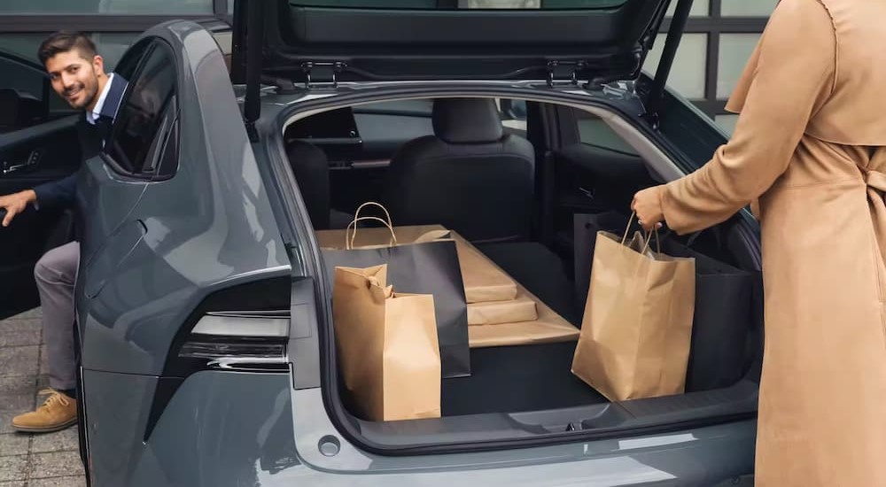 The cargo space of a gray 2023 Toyota Prius Prime is shown.
