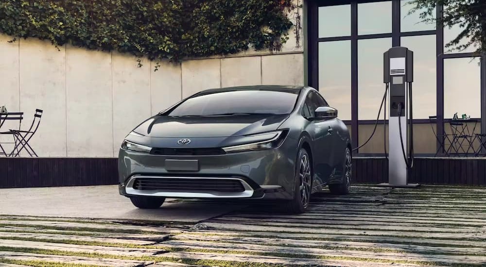 A gray 2023 Toyota Prius Prime is shown charging.