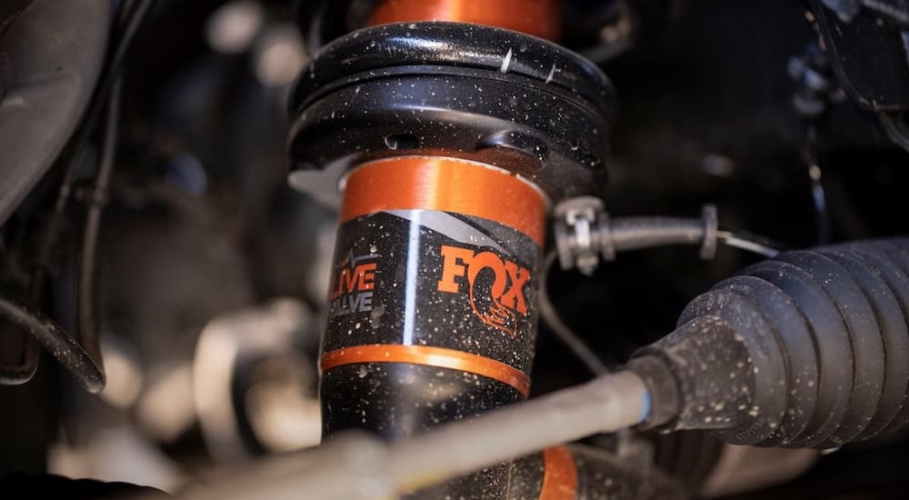 An orange Fox Racing-Shox shock absorber is shown.