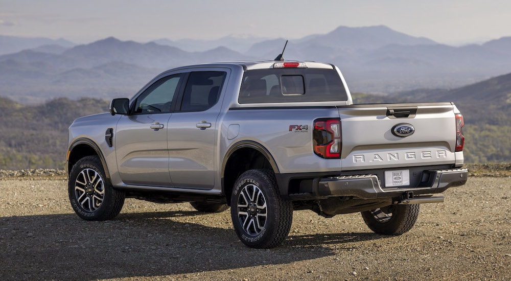 A silver 2024 Ford Ranger Lariat is shown from the rear at an angle.