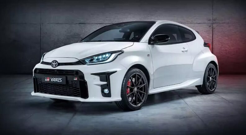 A white 2021 Toyota Hot Hatch is shown parked inside.