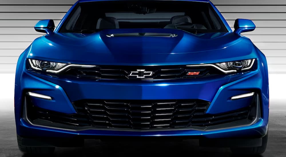 A blue 2024 Chevy Camaro SS is shown from the front.