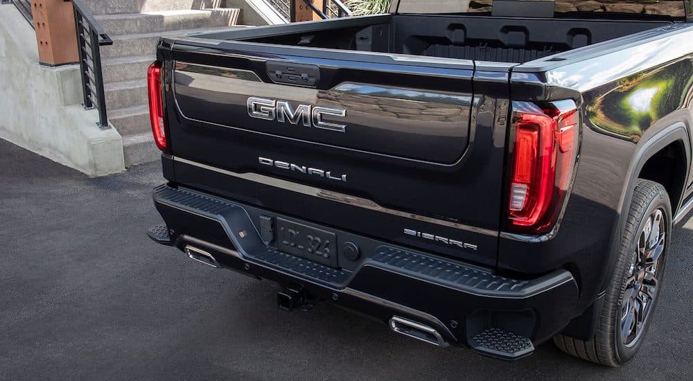 A close-up on the bed of a black 2024 GMC Sierra 1500 Denali is shown.