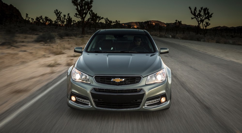 A grey 2015 Chevrolet SS is shown driving in a desert.