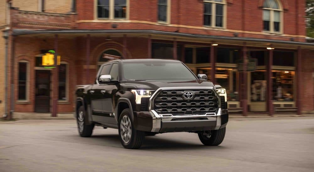 A black 2023 Toyota Tundra 1794 Edition is shown driving through town.