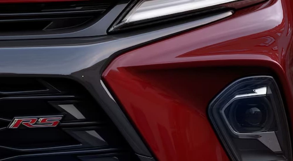 A close-up of the front of a red 2024 Chevy Blazer RS is shown.