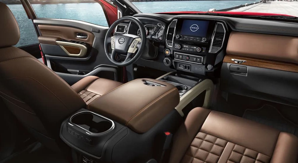 The brown interior and dash of a 2024 Nissan Titan is shown.