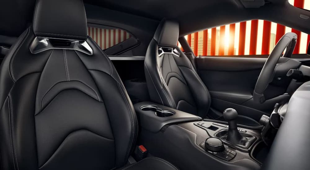 The black interior of a 2024 Toyota GR Supra is shown.
