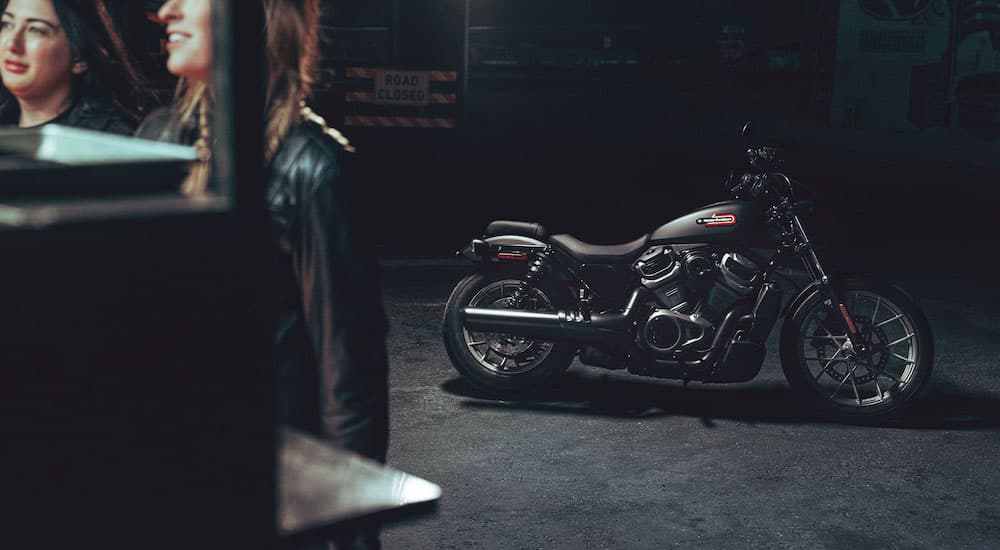 A black 2023 Harley-Davidson Nightster Special is shown parked in a garage.