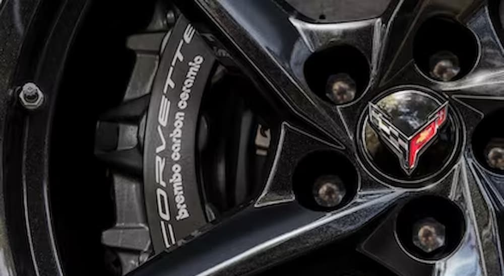 A close-up of a wheel on a 2024 Chevy Corvette E-Ray is shown.