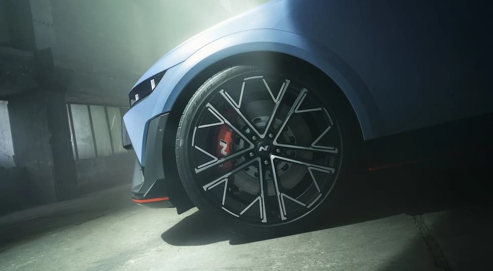 The wheel of a blue 2024 Hyundai IONIQ 5 N is shown.