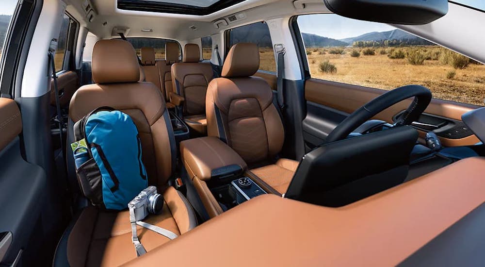 The brown leather interior of a 2024 Nissan Pathfinder is shown.
