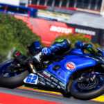 A blue Yamaha motorcycle is shown racing at a World Superbike event.