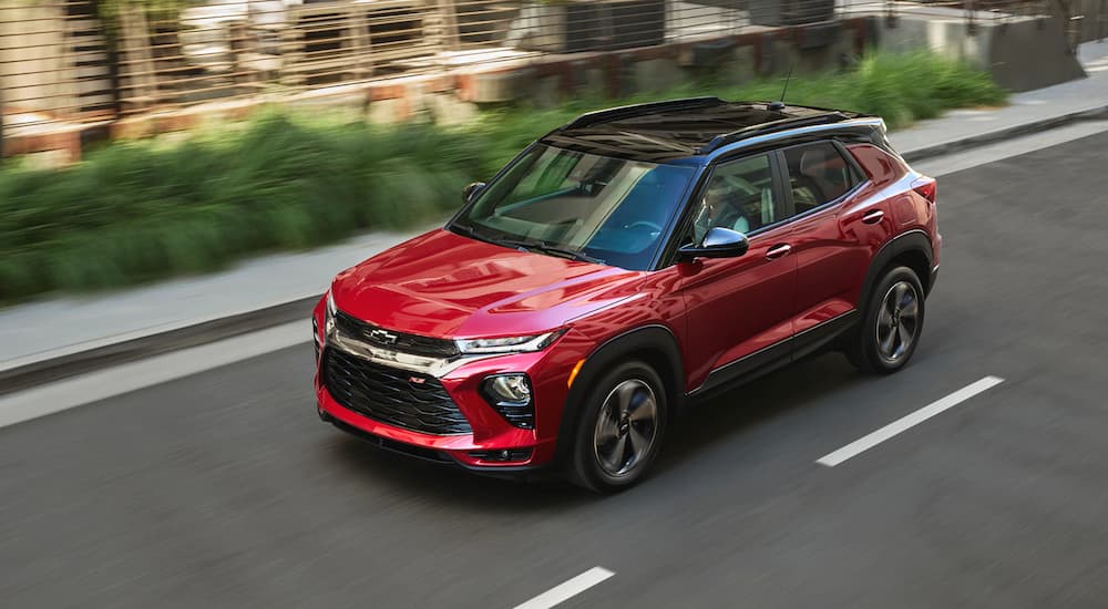 A red 2021 Chevy Trailblazer is shown driving.
