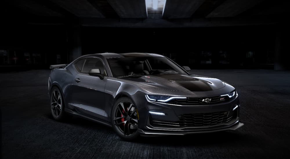 A black 2024 Chevy Camaro ZL1 is shown parked under a single light.