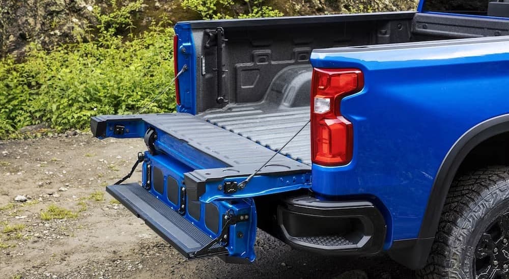 A popular feature on a Chevy Silverado for sale, a close-up of the tailgate on a blue 2024 Chevy Silverado 1500 ZR2, is shown.