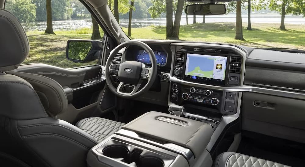 The gray interior and dash of a 2024 Ford F-150 is shown.