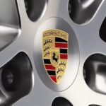 A Porsche Logo is shown on a rim of a Porsche Boxster/Cayman.