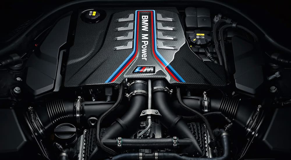 An all black BMW M power engine on a black background.
