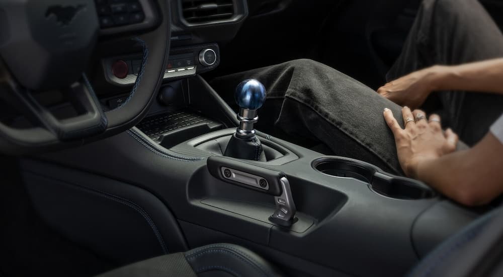 The anodized blue shift knob in a 2024 Ford Mustang for sale at a Ford dealer.