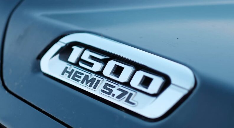 A close-up on the HEMI badge of a 2024 Ram 1500.