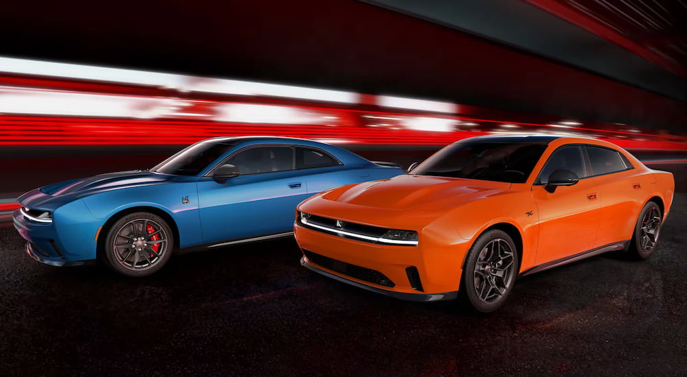 An orange 2024 Dodge Charger Daytona and 2025 Dodge Charger Six Pack are shown.