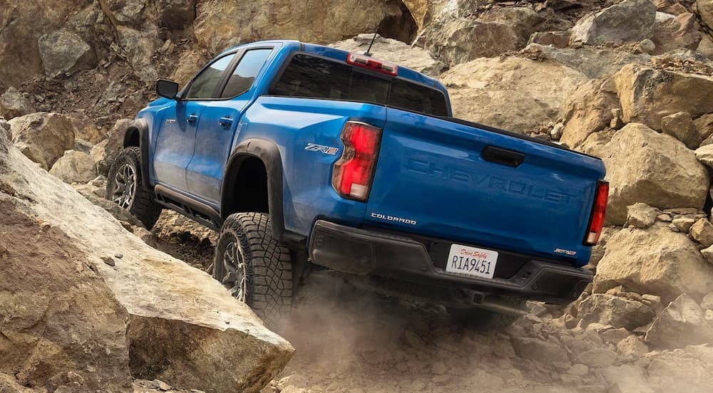 A blue 2024 Chevy Colorado ZR2 s shown driving off-road.