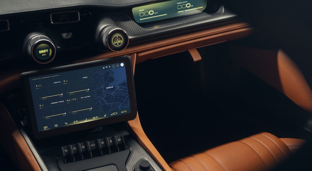 A close-up of the infotainment screen in a 2024 Rimac Nevera is shown.