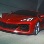 A red 2024 Chevy Corvette Z06 driving in a tunnel.