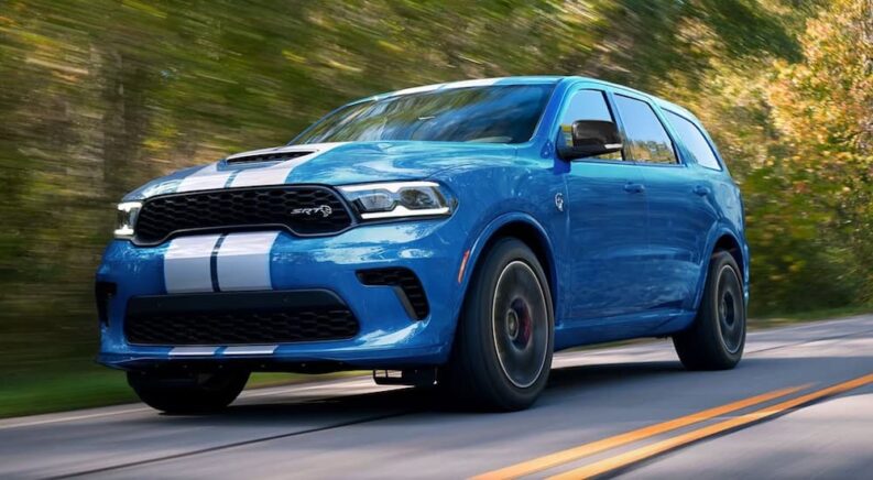 A blue 2024 Dodge Durango SRT Hellcat is shown from the front at an angle after leaving a Dodge dealer.