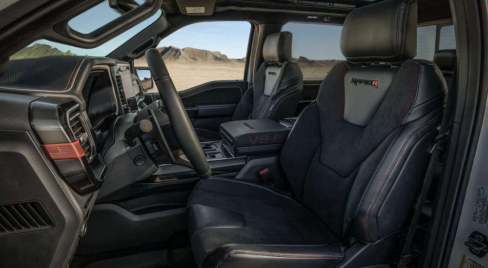 The black and gray interior in a 2024 Ford F-150 Raptor R is shown.