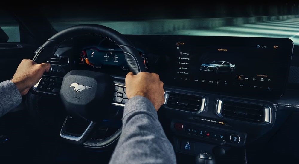 The black interior and dash in a 2024 Ford Mustang is shown.