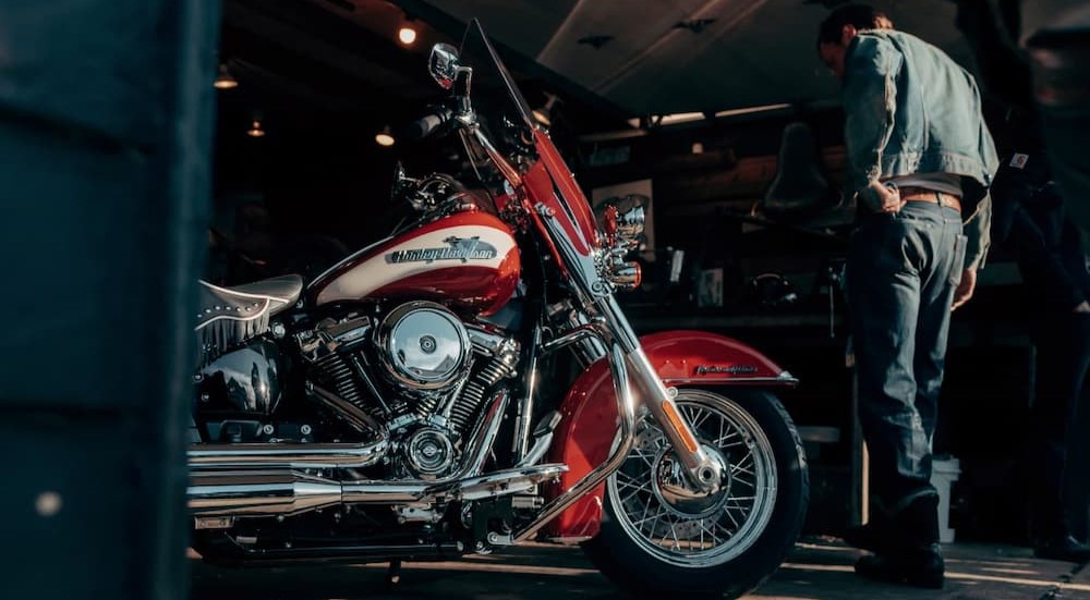 A red 2024 Harley-Davidson Hydra-Glide Revival is shown parked in a garage.