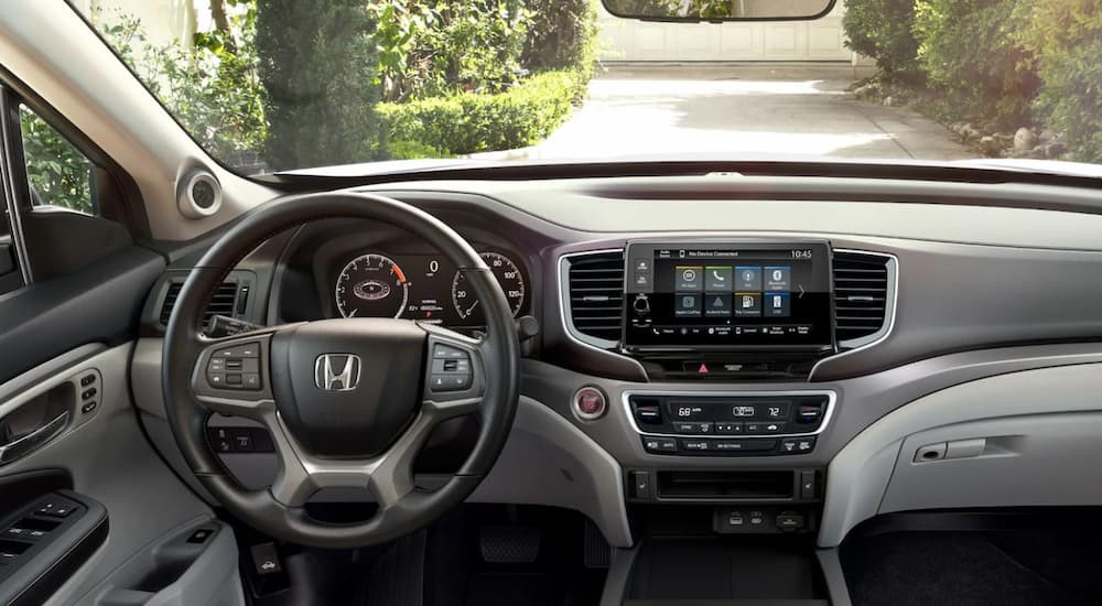 The gray interior and dash in a 2024 Honda Ridgeline is shown.