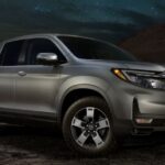 A silver 2024 Honda Ridgeline TrailSport is shown parked after visiting a Honda dealer.