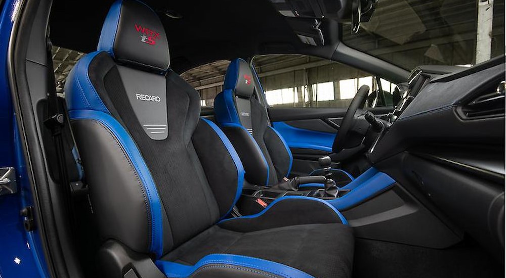 The black and blue interior and dash in a 2025 Subaru WRX tS is shown.