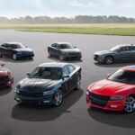 Aerial view of 2015 Dodge Chargers of varying trim levels at a used Dodge dealership.