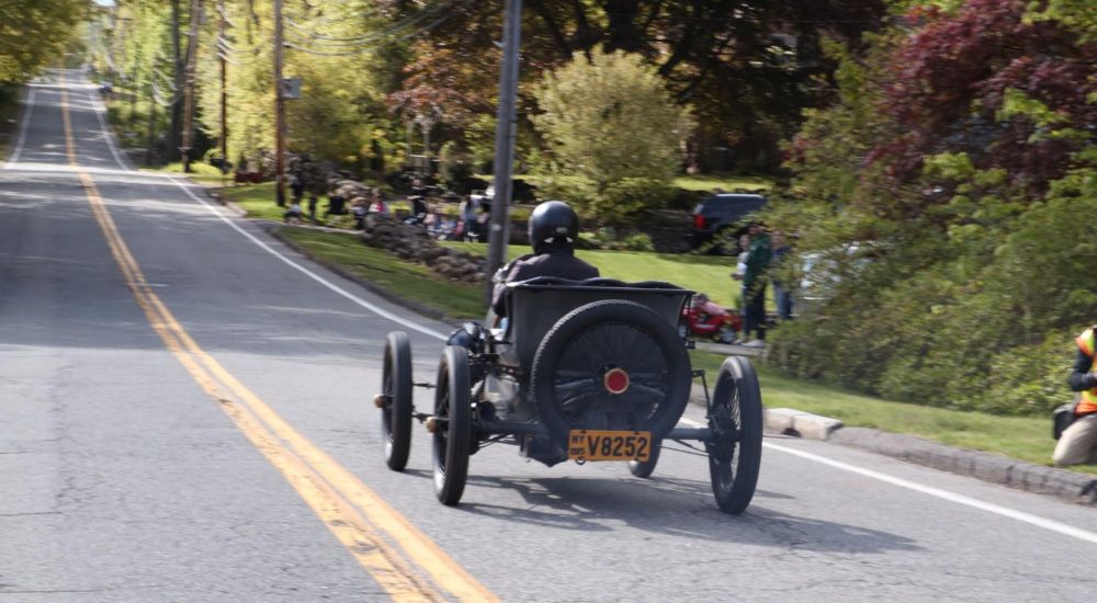 A black1915 Ford Model T Speedster is shown from the rear.