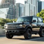 A black 2021 Ford Bronco Black Diamond is shown from the front at an angle after leaving a dealer that has a used Ford Bronco for sale.