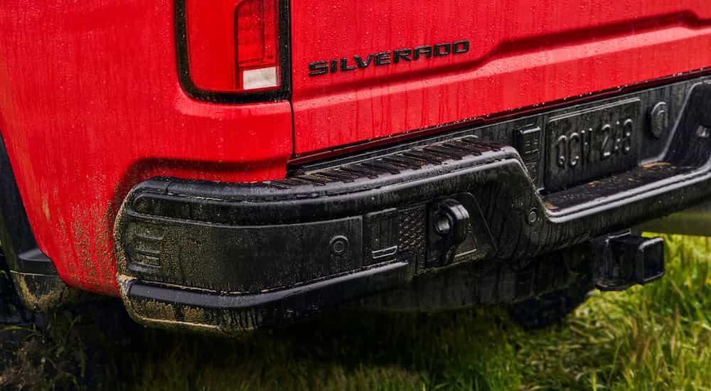 A close up of the rear bumper of a red 2024 Chevy Silverado 2500 HD ZR2 Bison.