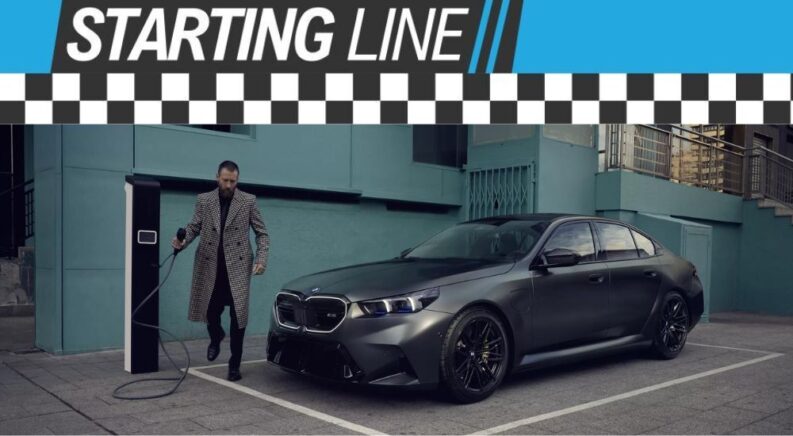 The Starting Line Banner is shown over a person and a black 2025 BMW M5.