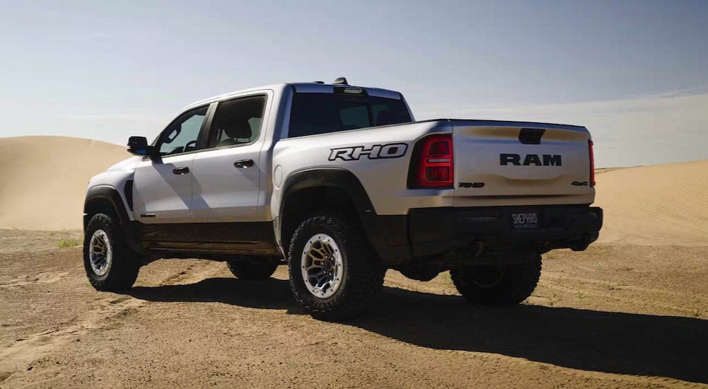 A silver 2025 Ram 1500 RHO is shown parked off-road.