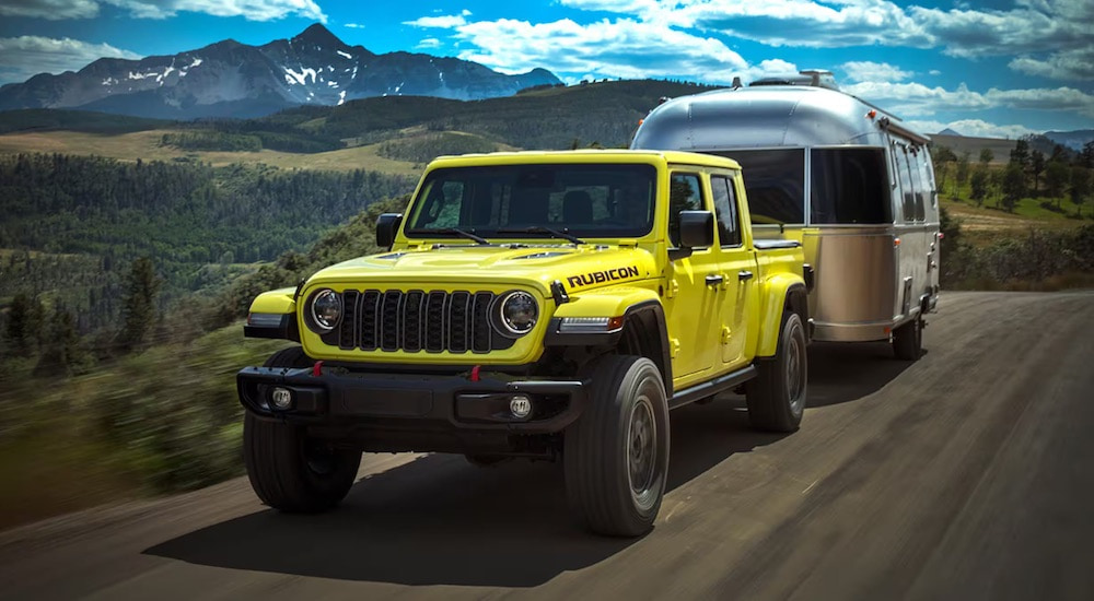 A yellow 2024 Jeep Gladiator Rubicon X is shown from the front at an angle.